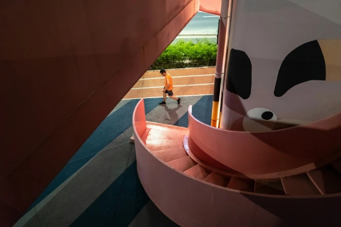2 men standing on brown concrete building during daytime